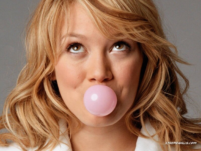 woman blowing bubble gum