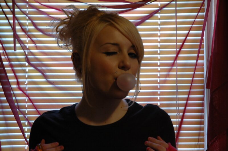 woman blowing bubble gum