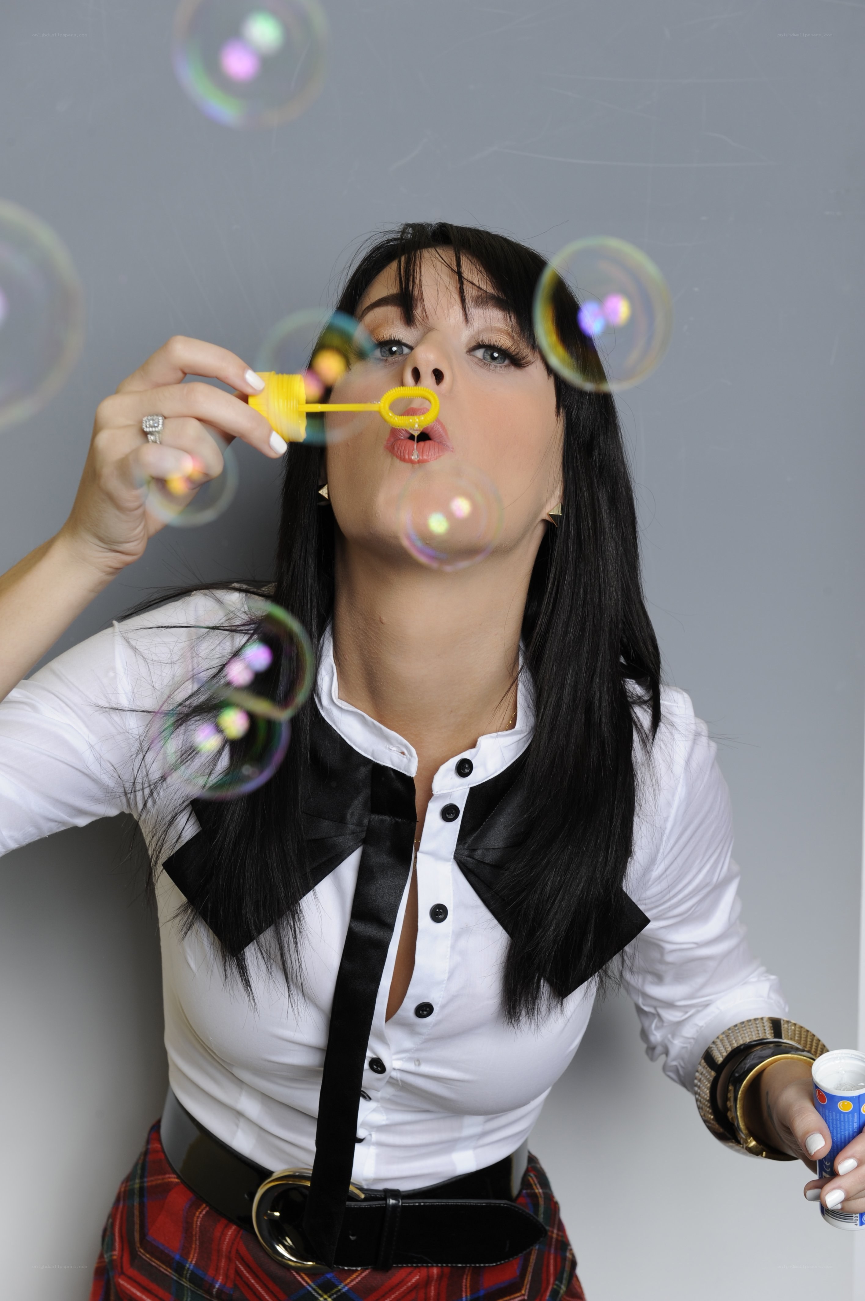 woman blowing bubbles