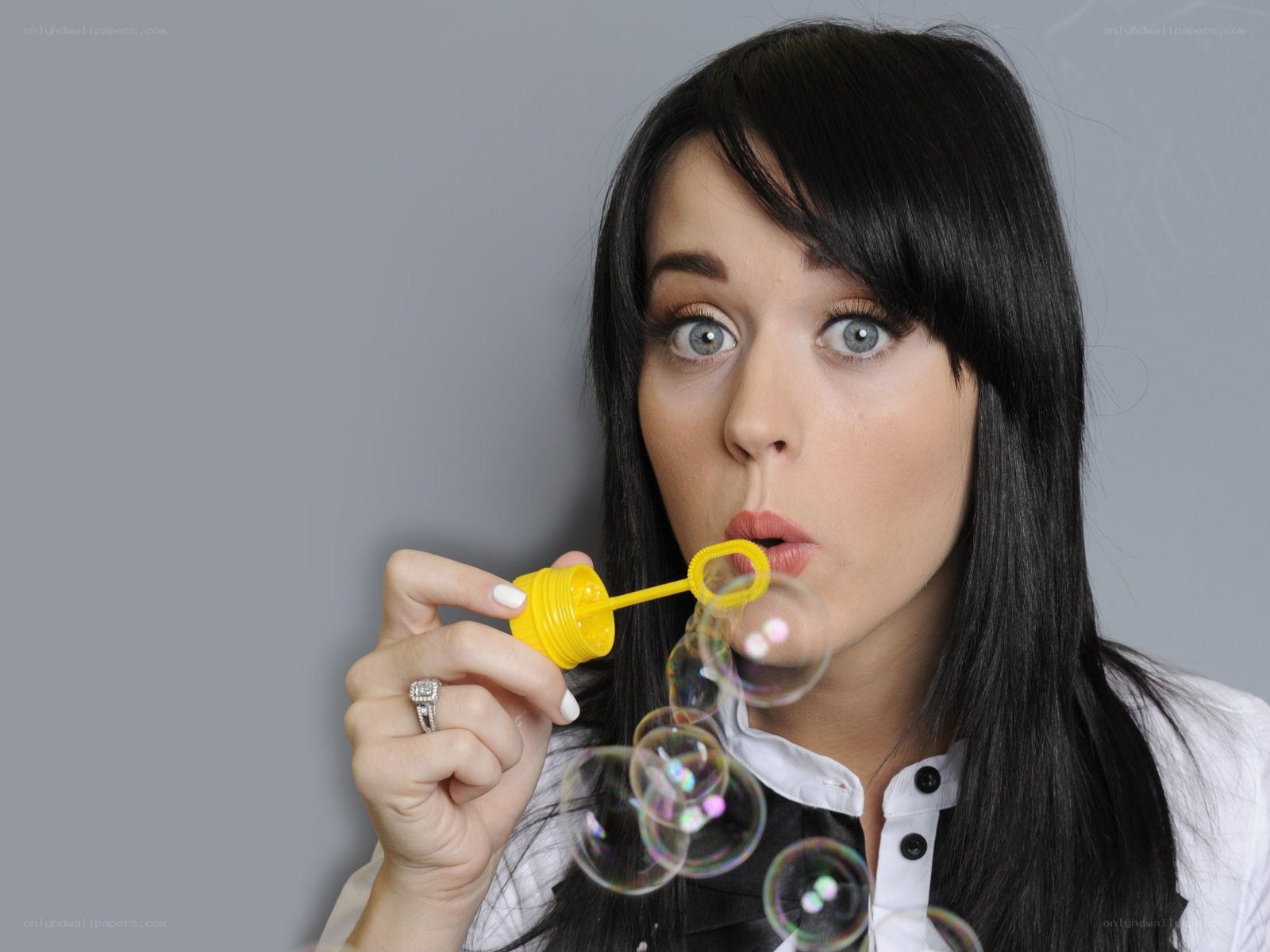 woman blowing bubbles