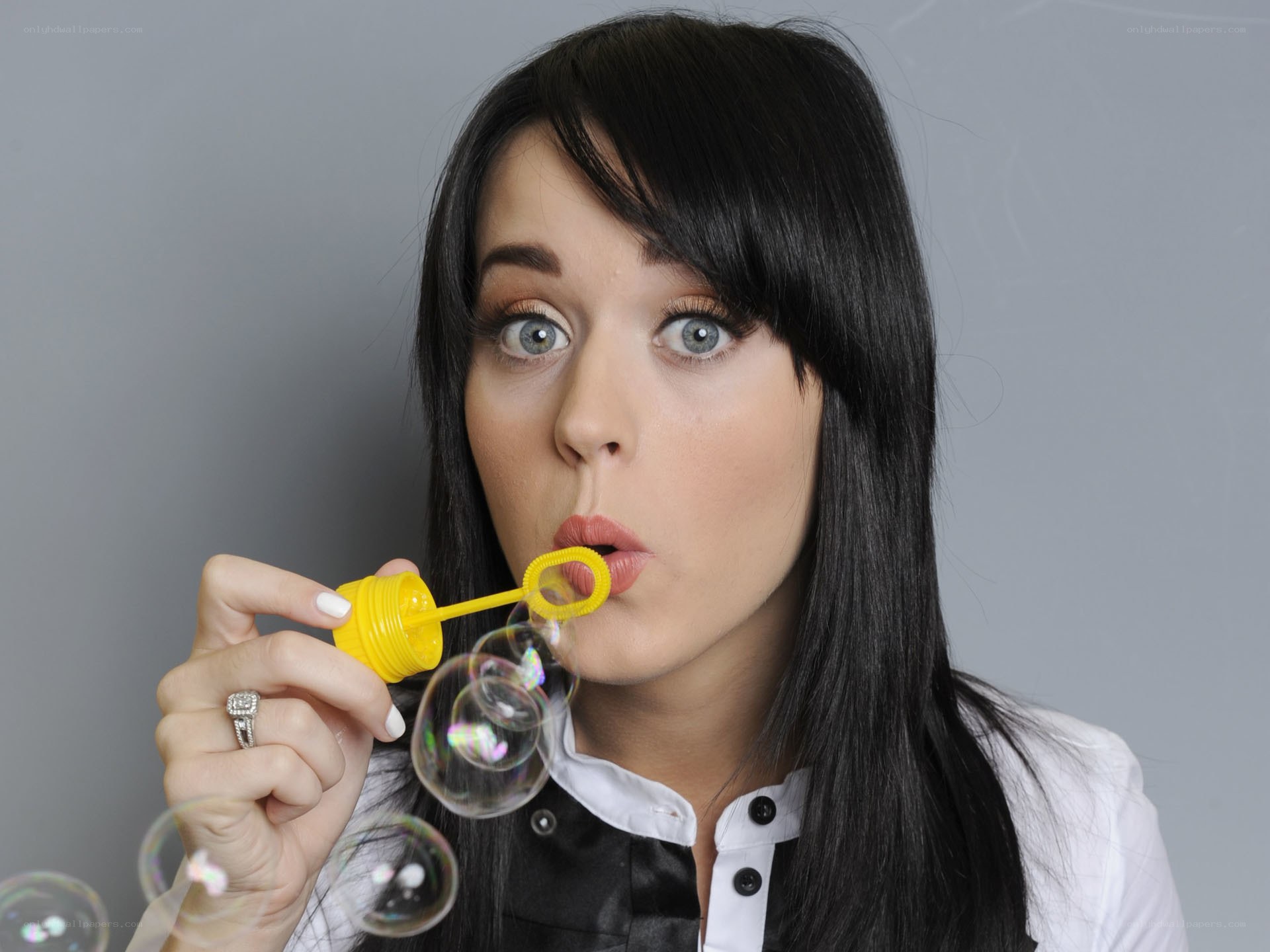woman blowing bubbles