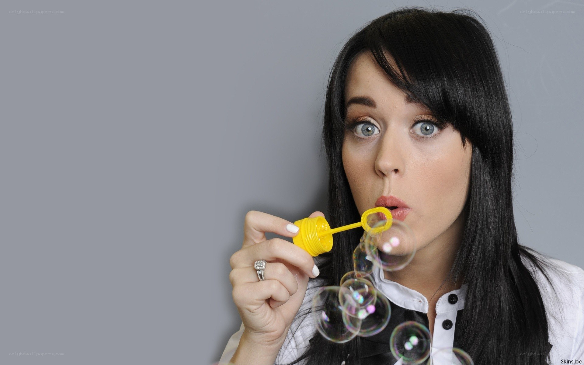 woman blowing bubbles