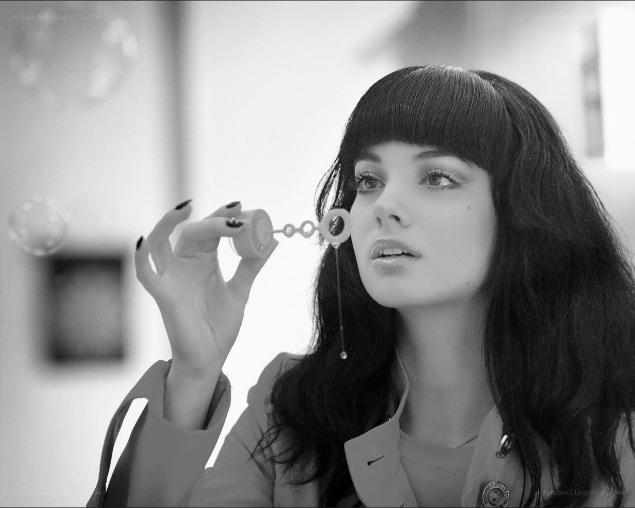 woman blowing bubbles