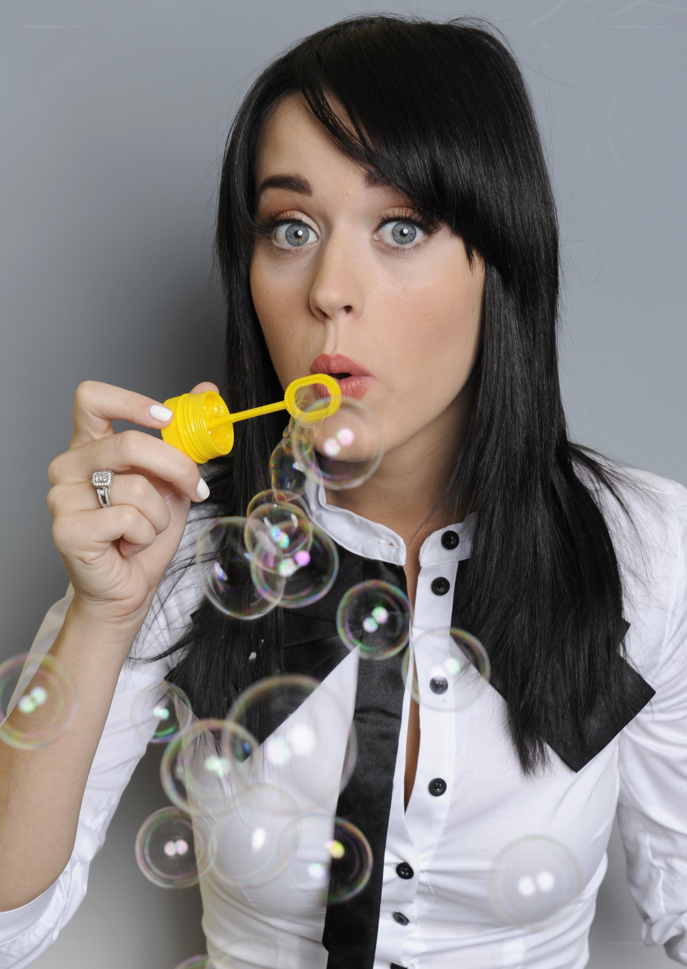 woman blowing bubbles