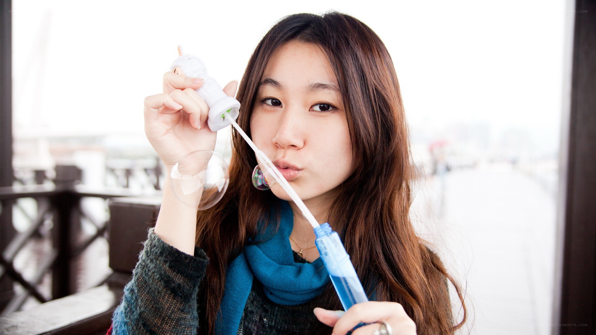 woman blowing bubbles