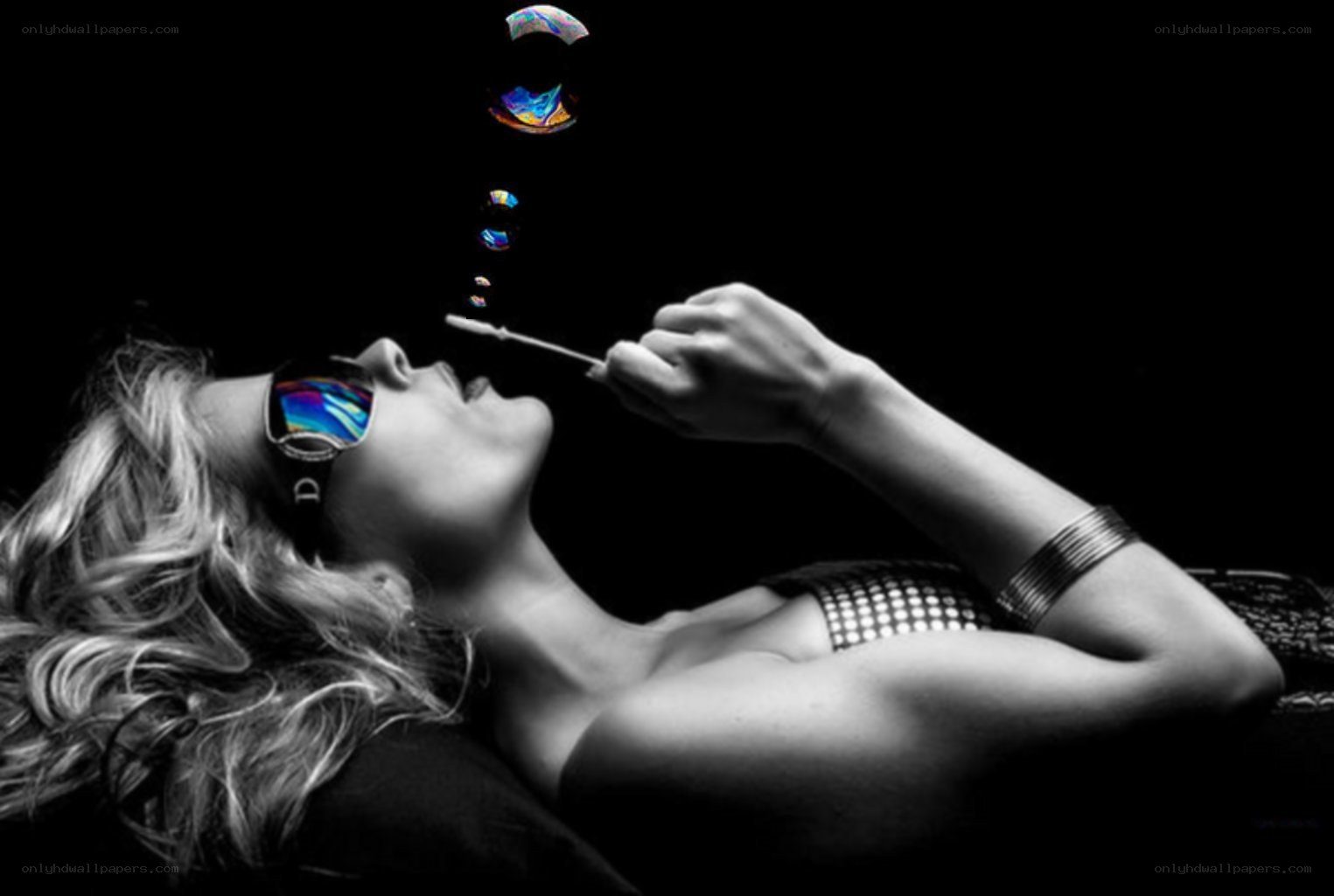 woman blowing bubbles