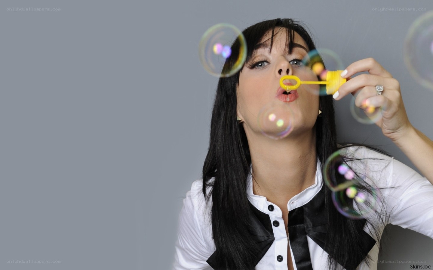 woman blowing bubbles