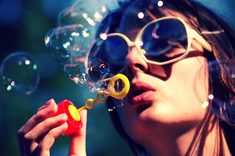 Woman Blowing Bubbles — Blue, Playful, Night