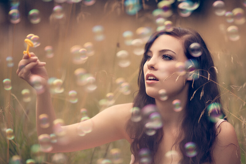 Woman Blowing Bubbles — Brown, Dreamy