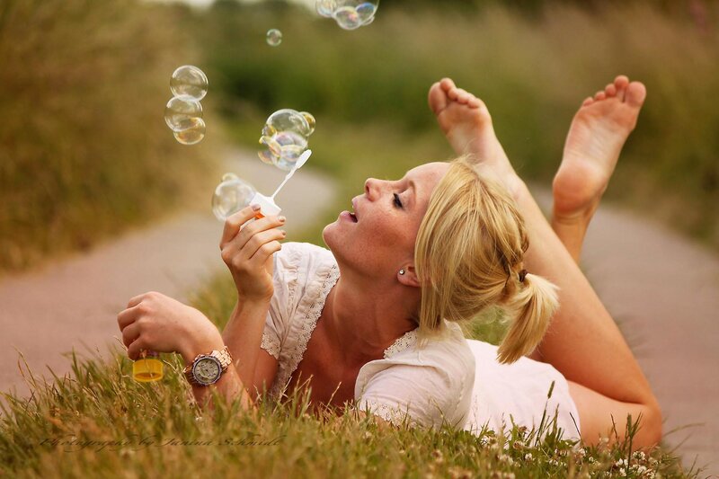 Woman Blowing Bubbles — Green, Playful, Afternoon, Photograph, Grass