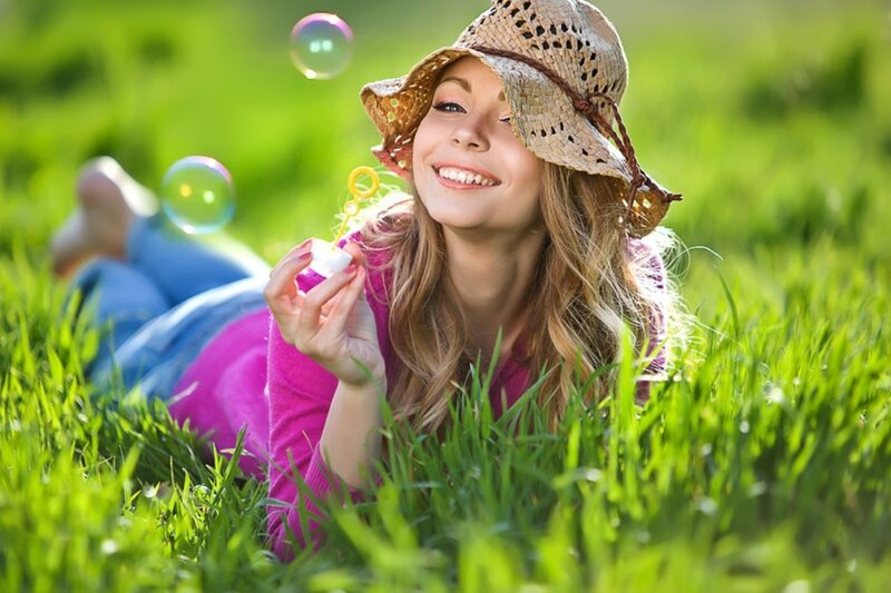 Woman Blowing Bubbles — Green, Playful, Afternoon, Photograph, Hat