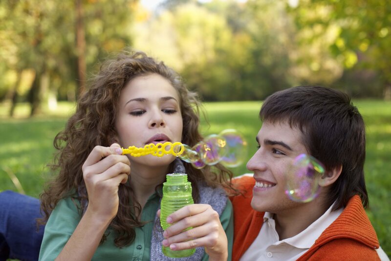 Woman Blowing Bubbles — Green, Playful, Afternoon, Photograph, Man