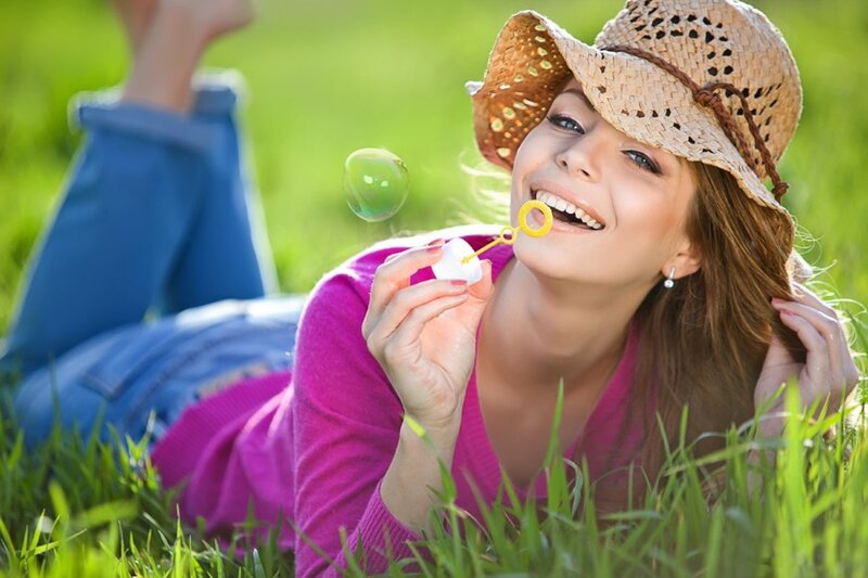 Woman Blowing Bubbles — Green, Playful, Afternoon, Photograph