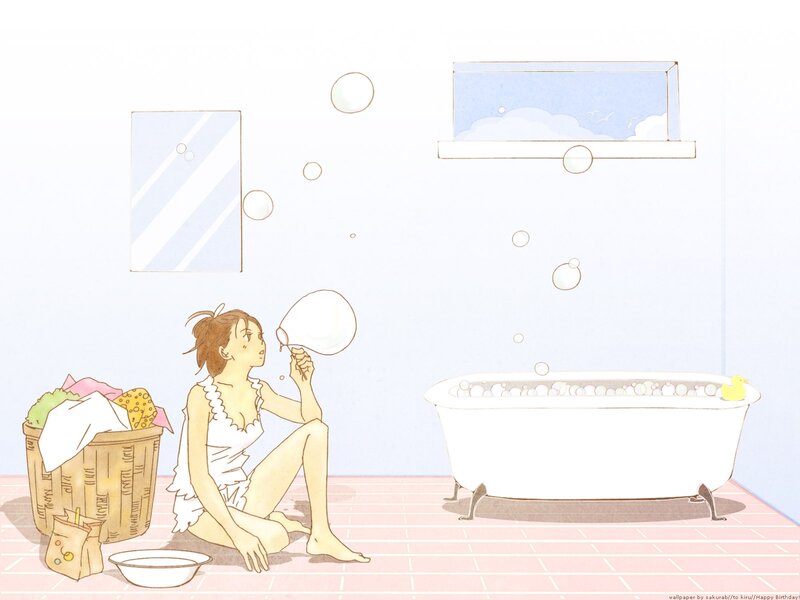 woman blowing bubbles in bathroom