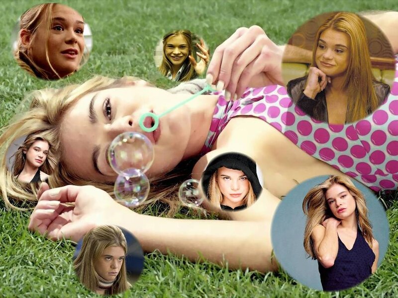woman blowing bubbles in grass