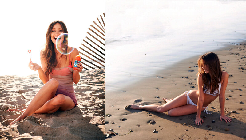 Woman blowing bubbles on beach