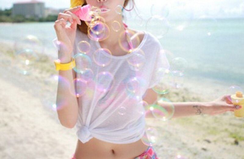 Woman Blowing Bubbles — White, Playful