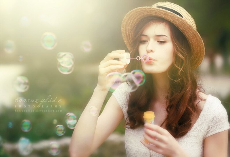 Woman Blowing Bubbles — White, Serene