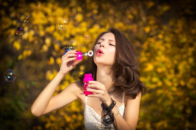 Woman Blowing Bubbles — Yellow, Playful, Autumn