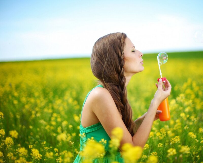 Woman Blowing Bubbles — Yellow, Serene, Afternoon, Photograph