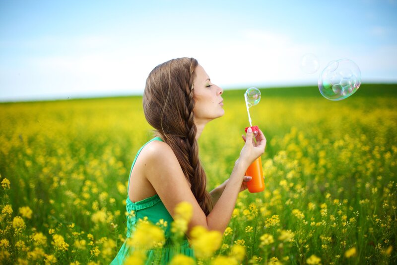 Woman Blowing Bubbles — Yellow, Serene