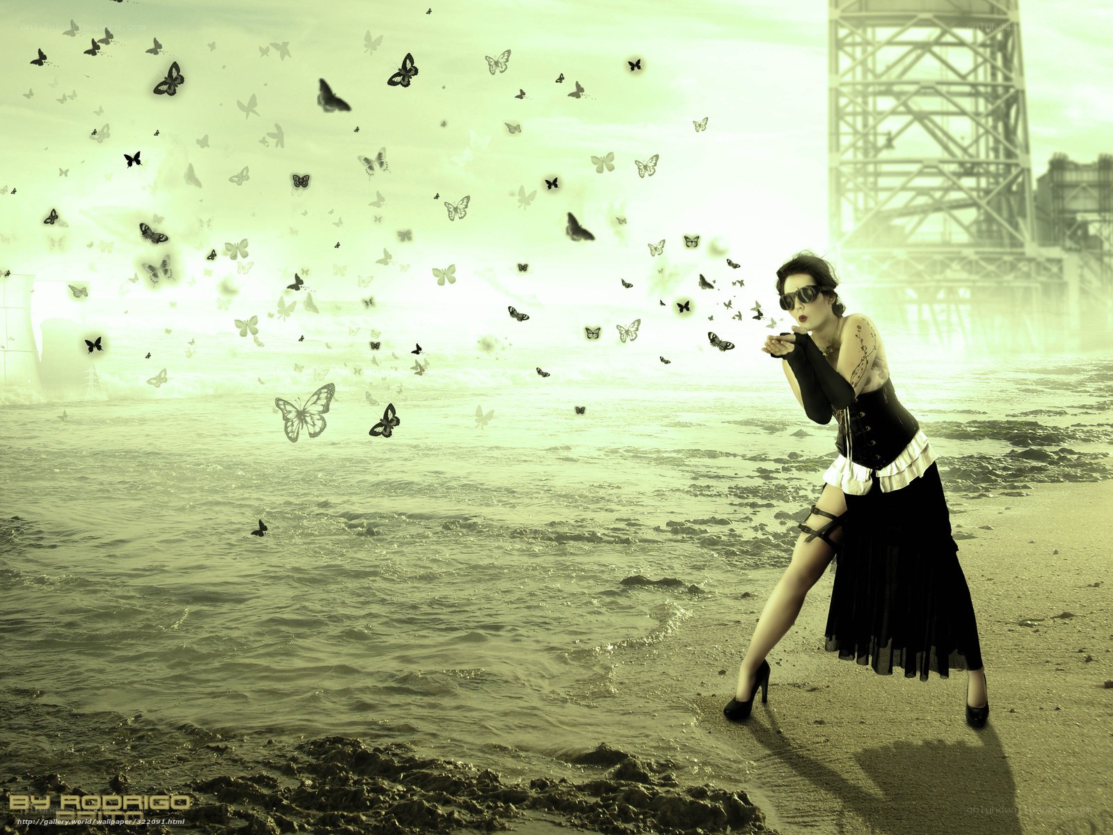 woman blowing butterflies on beach