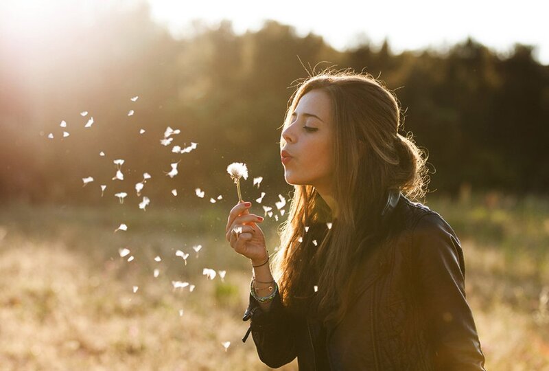 Woman Blowing Dandelion — Brown, Serene, Sunset