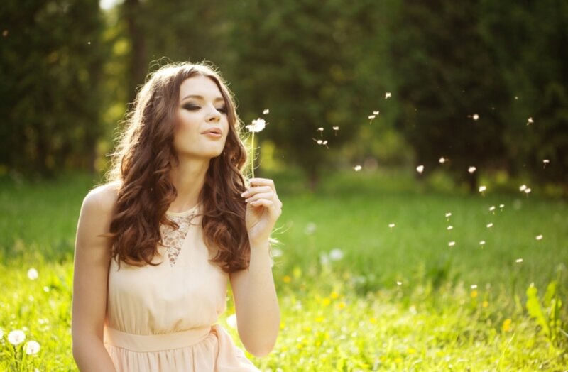 Woman Blowing Dandelion — Green, Serene