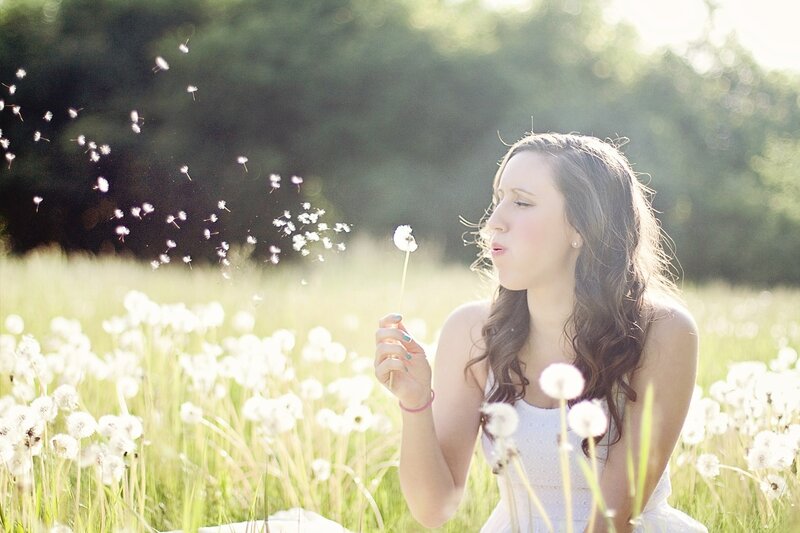 Woman Blowing Dandelion — White