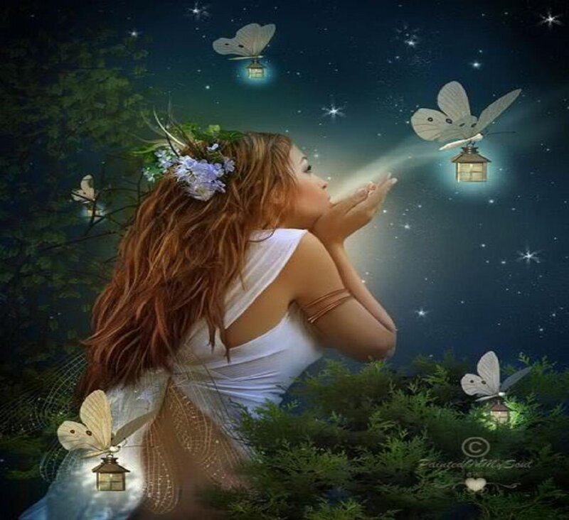 woman blowing fairy lights