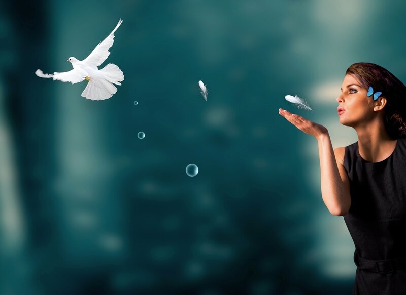 Woman Blowing Feather