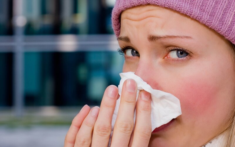 Woman Blowing Nose