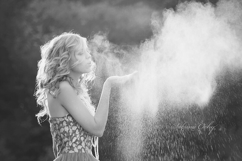 Woman Blowing Powder