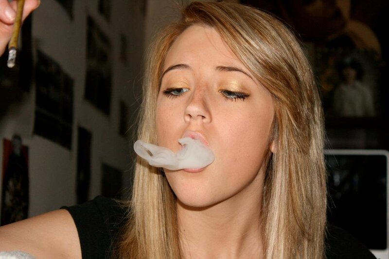 woman blowing smoke ring