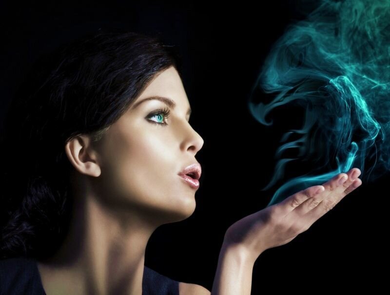 Woman Blowing Smoke