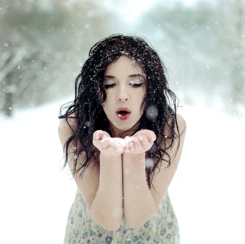 Woman Blowing Snow — White, Serene, Winter