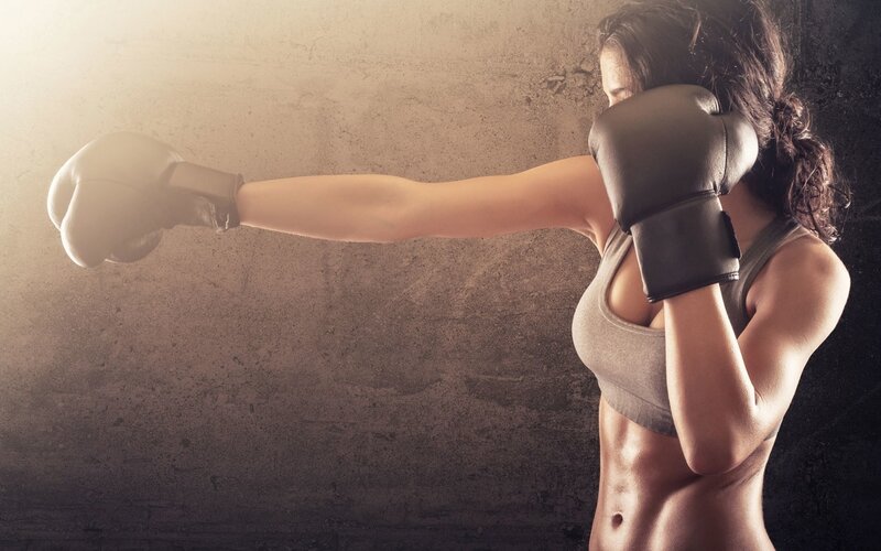 Woman Boxing in Gym — Brown