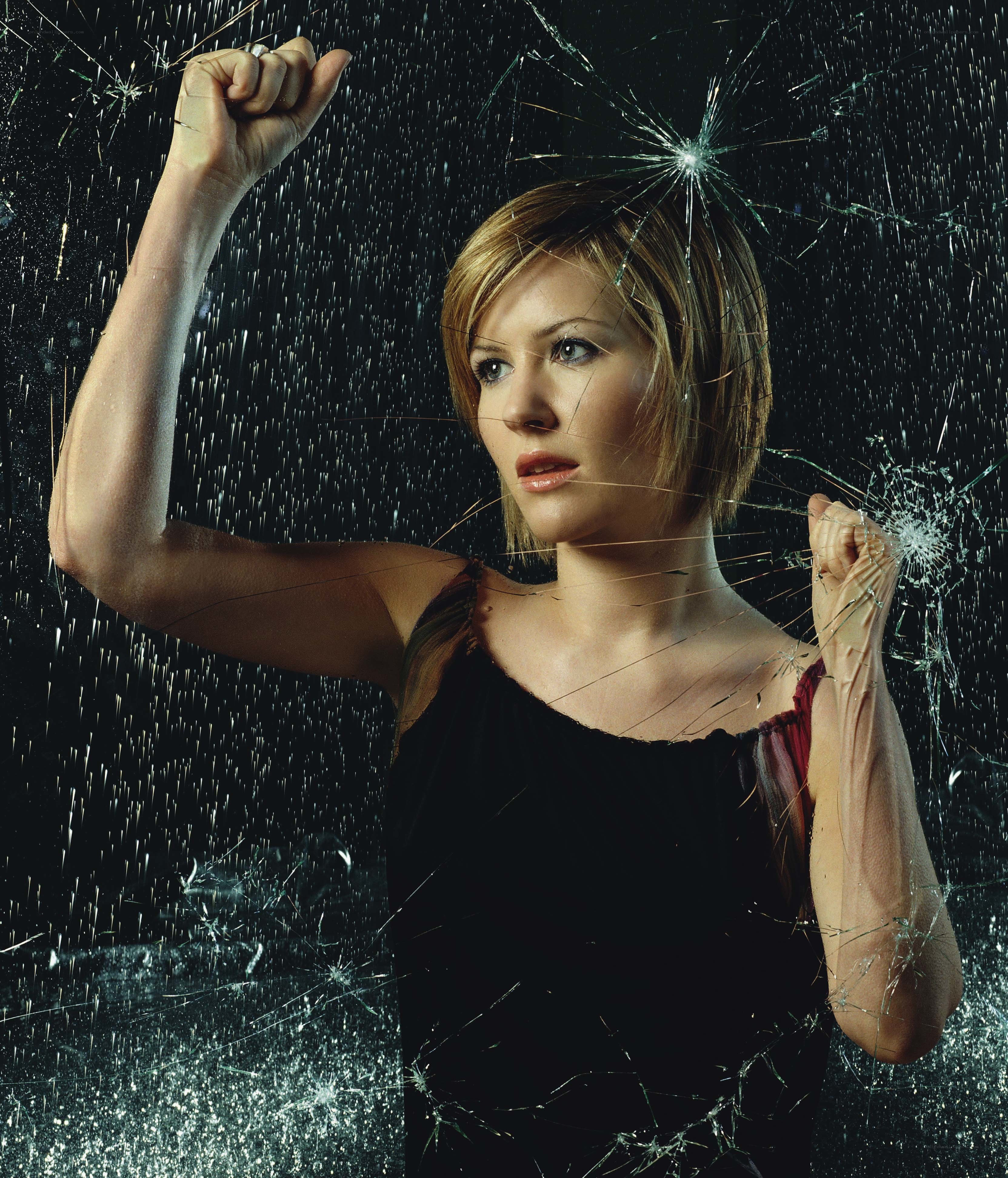 woman breaking glass