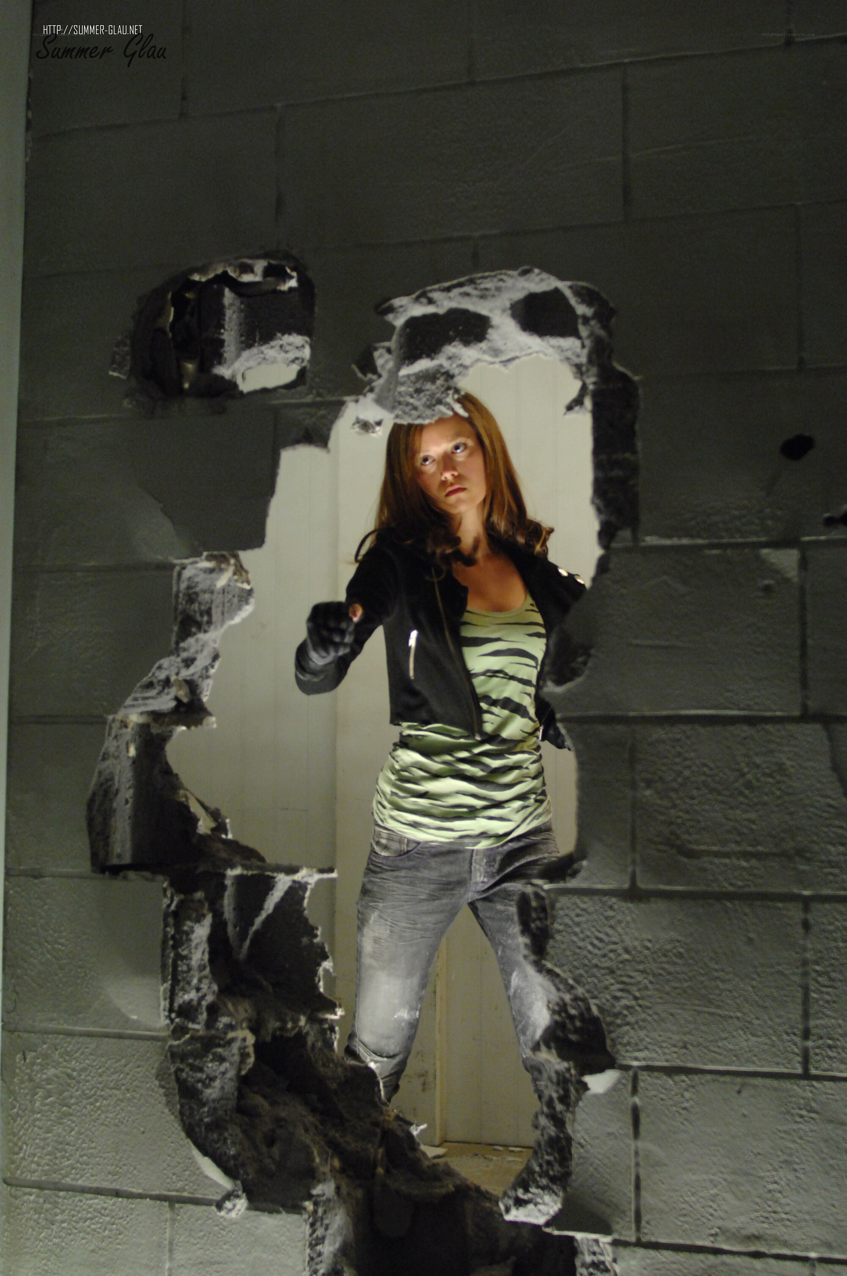 woman breaking through wall