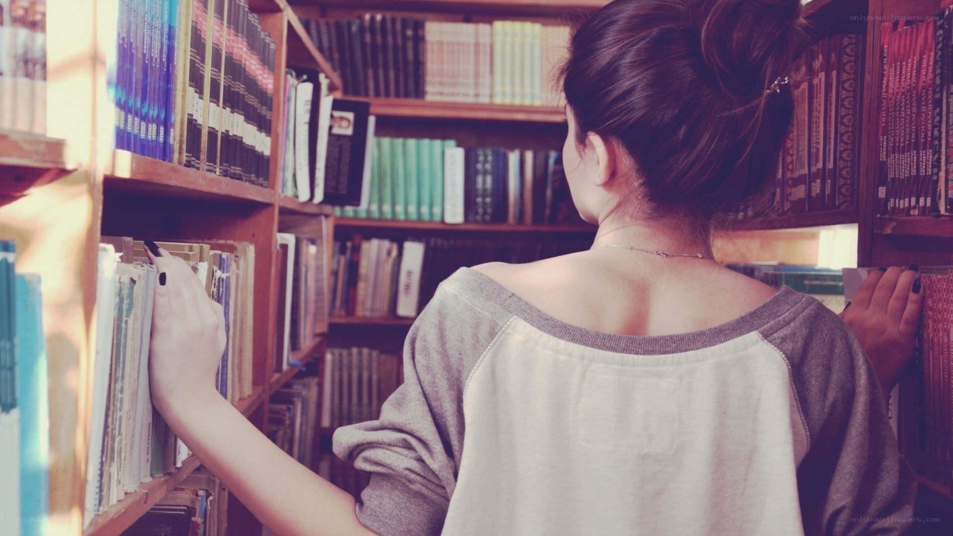 woman browsing books in library