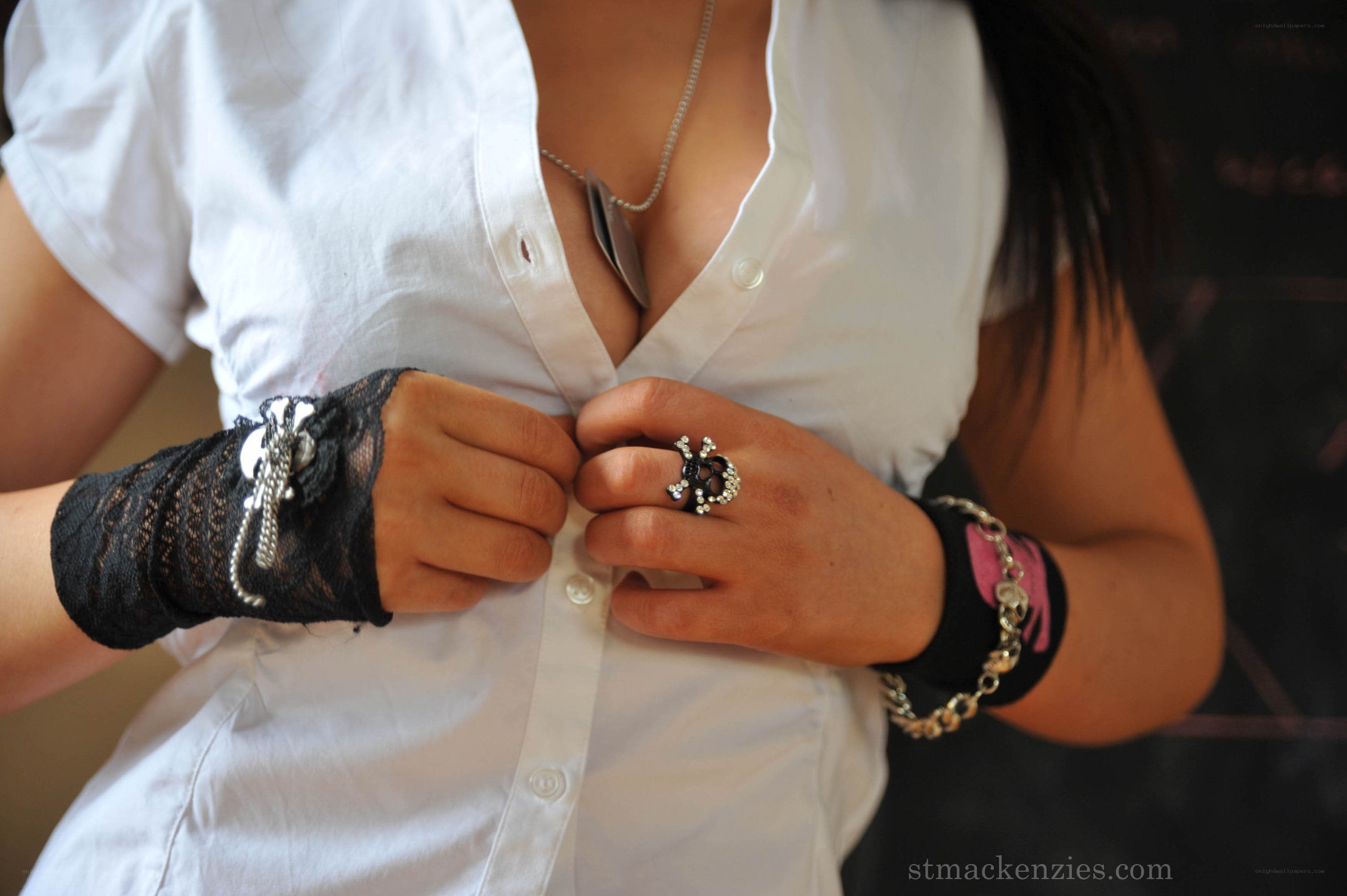 woman buttoning white shirt
