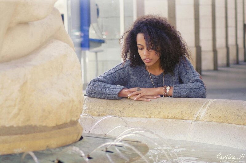 woman by a fountain