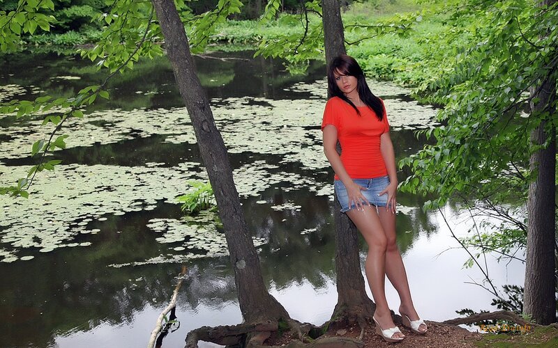 Woman by a pond in nature