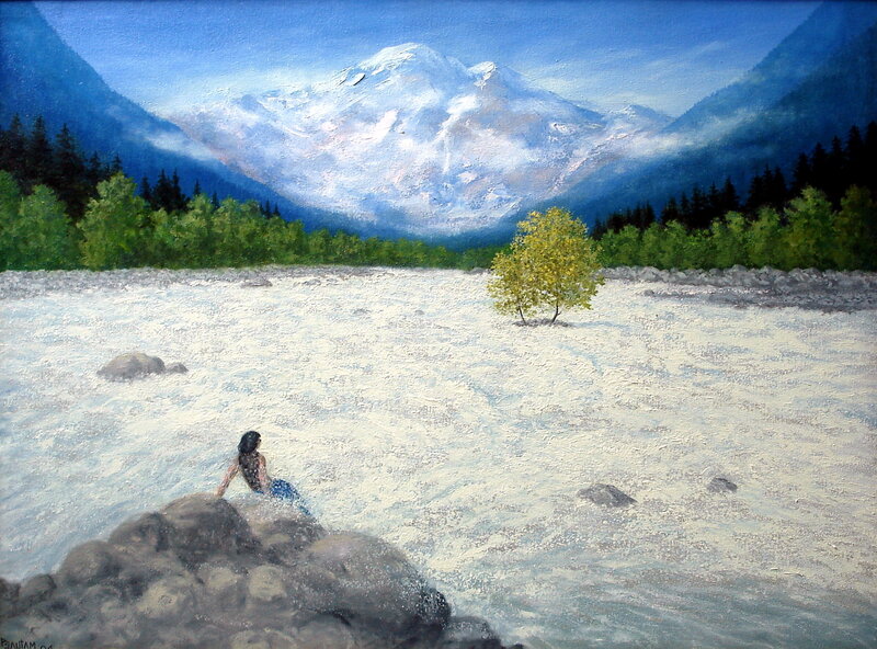 Woman by a river with mountain view
