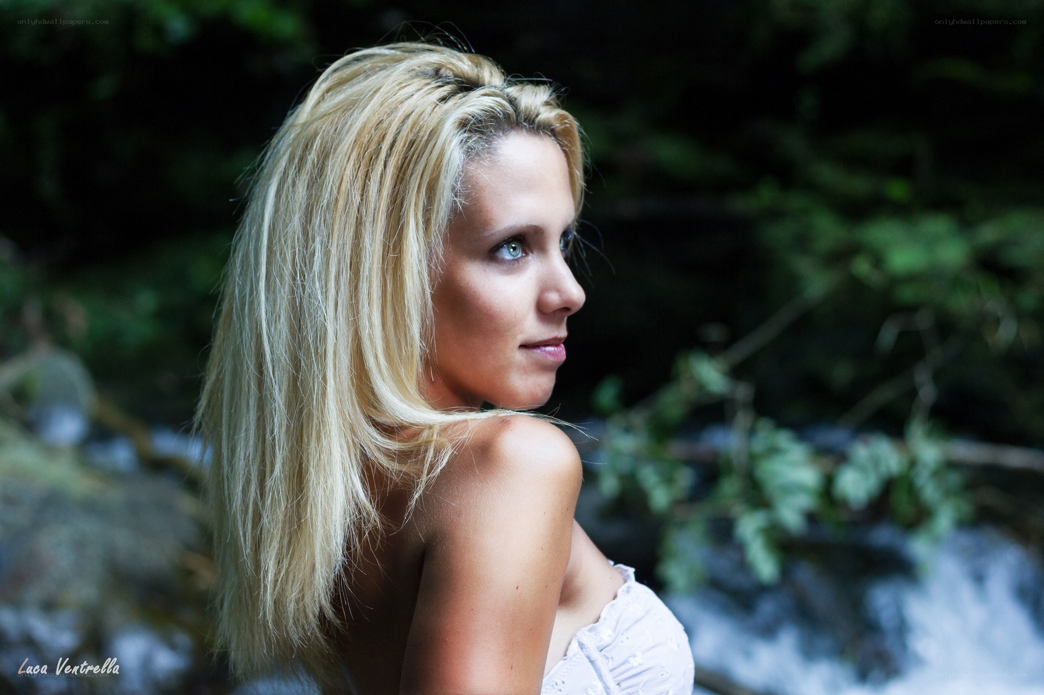 woman by a stream
