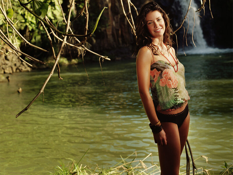 Woman by a waterfall