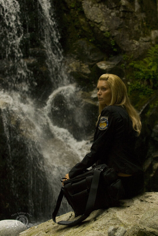 Woman by a waterfall