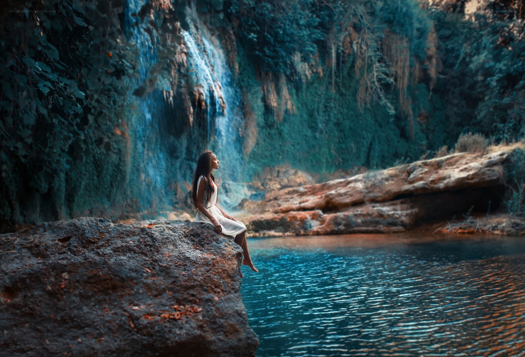 Woman by a waterfall