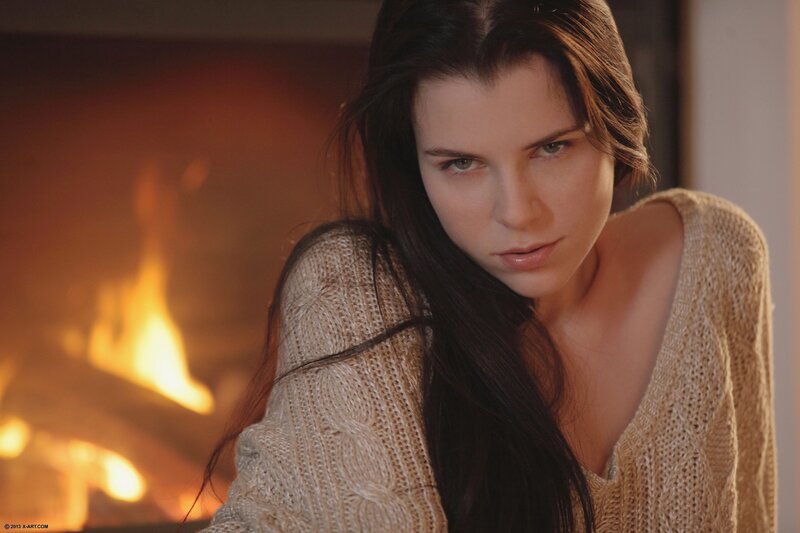 woman by the fireplace