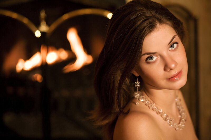 woman by the fireplace